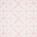 Andromeda Pink uncoated nonwoven wallpaper with a soft, shibori-inspired geometric pattern by Schumacher