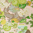 Chiang Mai Dragon Blush wallpaper by Schumacher featuring a vibrant chinoiserie dragon and floral motif in green, yellow, and white on a blush pink background.