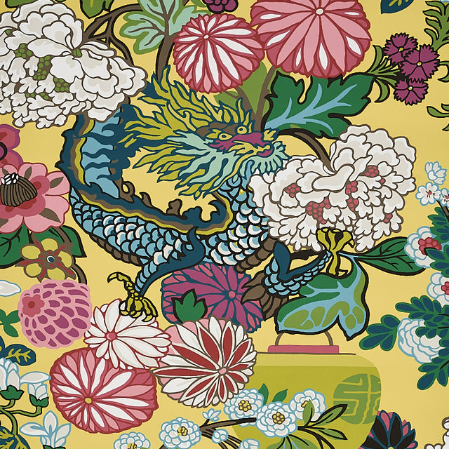 Chiang Mai Dragon wallpaper in yellow by Schumacher featuring a vibrant chinoiserie dragon and floral motif.