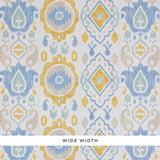 ELIZIA IKAT wallpaper in sky and ochre, a wide-width wallcovering with a delicate ikat pattern in blue, yellow, and beige tones.