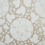 Marianne Champagne by Schumacher - Pop Art floral wallpaper in champagne and white, shown in detail and styled in a bedroom setting.