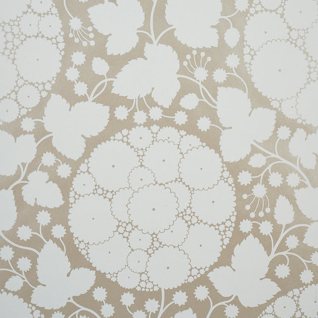 Marianne Champagne by Schumacher - Pop Art floral wallpaper in champagne and white, shown in detail and styled in a bedroom setting.