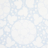 Marianne Sky large-scale floral wallpaper with silhouetted dandelion pattern by Schumacher, shown in a bathroom interior.