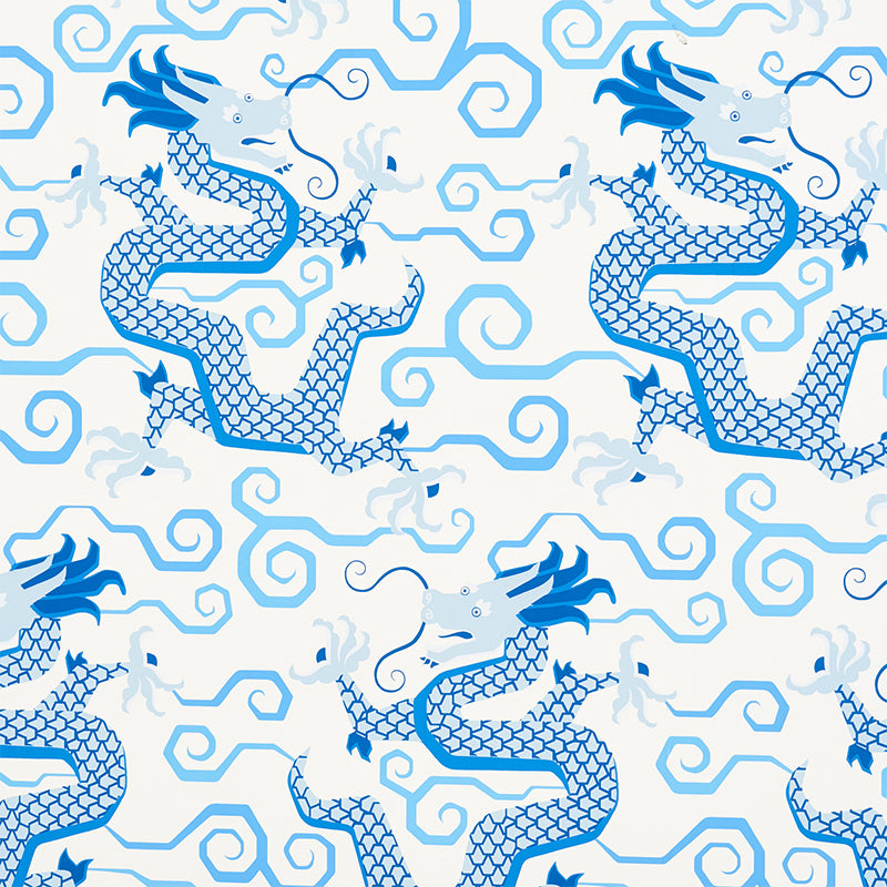 BIXI Porcelain wallpaper featuring blue dragons and swirling clouds on a white background, from Schumacher's Fire Breather collection.