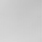 Dolomite Performance white textured high performance wallcovering by Schumacher shown in a modern bedroom setting