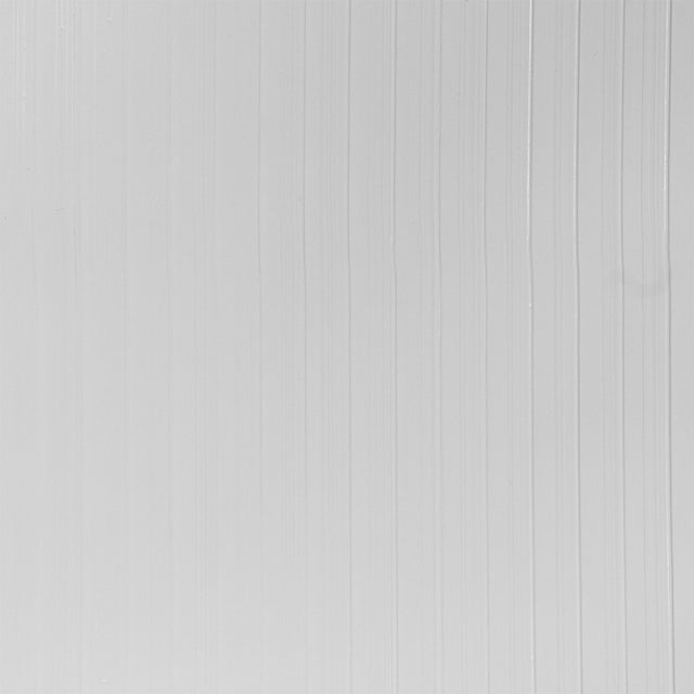 Dolomite Performance white textured high performance wallcovering by Schumacher shown in a modern bedroom setting