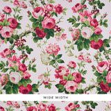Nancy Floral wallpaper in Rose by Schumacher, featuring exuberant pink and red rose blossoms with green foliage on a light background.