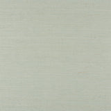 Haruki Sisal Aloe grasscloth wallpaper by Schumacher shown in close-up and styled in a modern interior setting.