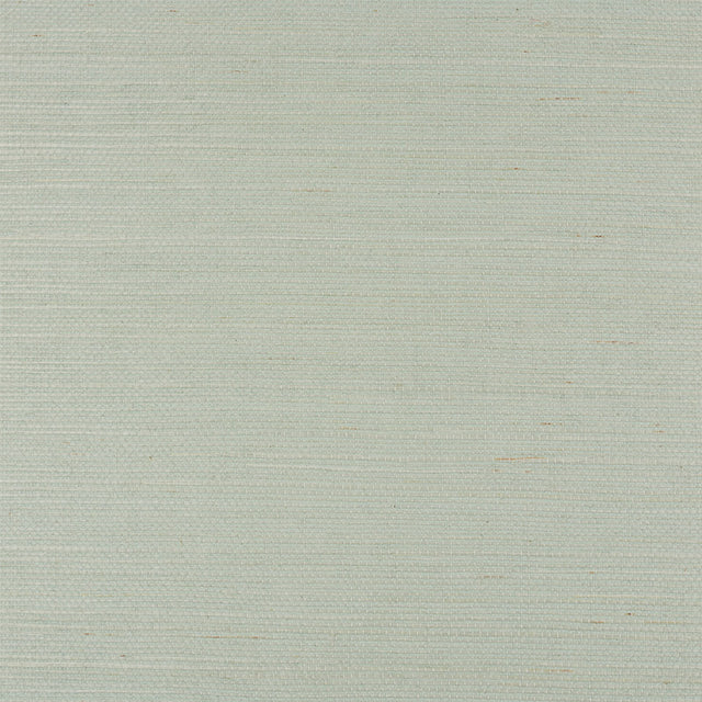 Haruki Sisal Aloe grasscloth wallpaper by Schumacher shown in close-up and styled in a modern interior setting.