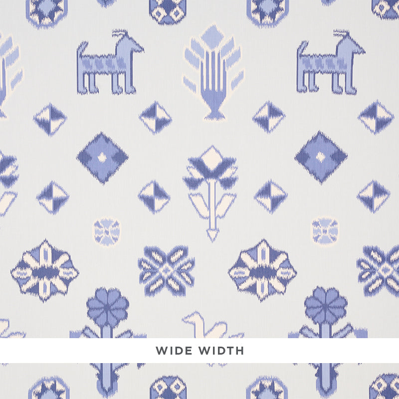 Chuska Warp Print wallpaper in blue with ikat-style horses, birds, and flowers by Schumacher, shown in a bathroom setting.