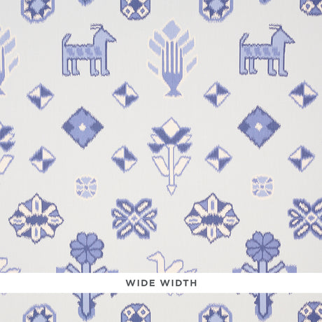 Chuska Warp Print wallpaper in blue with ikat-style horses, birds, and flowers by Schumacher, shown in a bathroom setting.