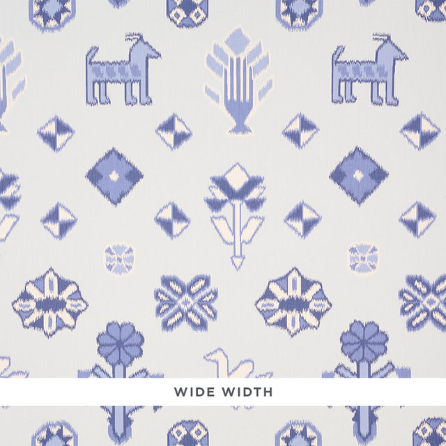 Chuska Warp Print wallpaper in blue with ikat-style horses, birds, and flowers by Schumacher, shown in a bathroom setting.