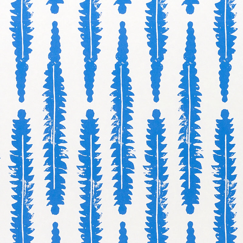 Blue fern leaf pattern wallpaper by Molly Mahon for Schumacher, inspired by English countryside foliage, hand block print style.