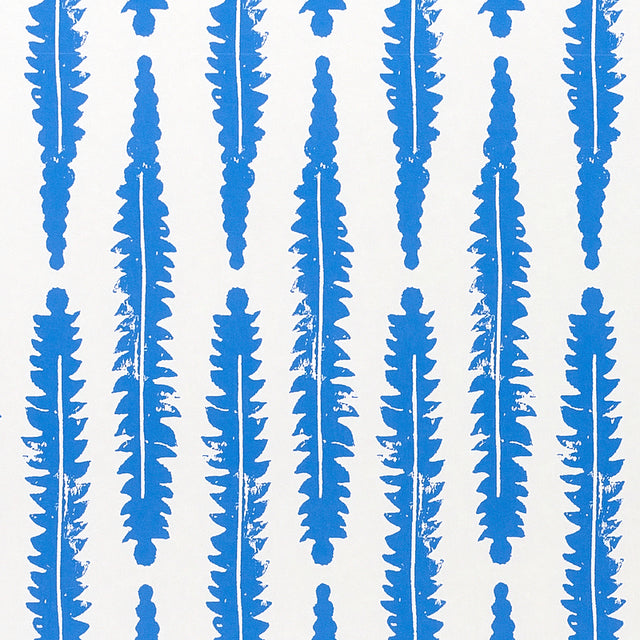 Blue fern leaf pattern wallpaper by Molly Mahon for Schumacher, inspired by English countryside foliage, hand block print style.