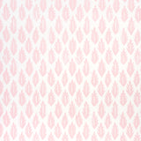 Pink leaf pattern wallpaper by Molly Mahon for Schumacher, hand block print style, shown in a bedroom setting.