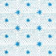 Blue dot and star block-print wallpaper by Molly Mahon for Schumacher, shown in a bedroom setting.