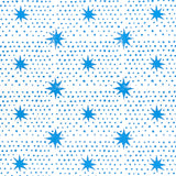 Blue dot and star block-print wallpaper by Molly Mahon for Schumacher, shown in a bedroom setting.