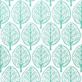 Tree Seaglass by Molly Mahon for Schumacher. Stylized tree motif wallpaper in green-blue on white, shown in room and detail views.