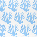 Blue coral branch pattern wallpaper by Molly Mahon for Schumacher, shown in a styled interior and close-up views.