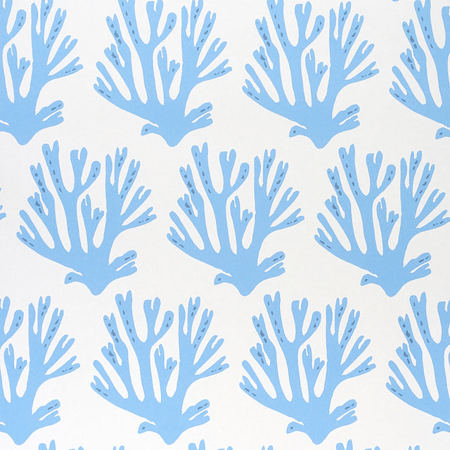 Blue coral branch pattern wallpaper by Molly Mahon for Schumacher, shown in a styled interior and close-up views.