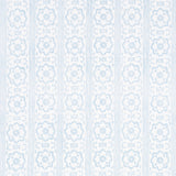 Sunda Hand Blocked Print wallpaper in Sky by Schumacher, featuring a soft geometric pattern with stripes and medallions in blue and white.