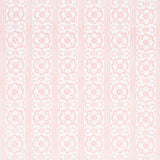 Sunda Hand Blocked Print wallpaper in blush by Schumacher, featuring a soft geometric pattern with stripes and medallions, handprinted for depth and dimension.