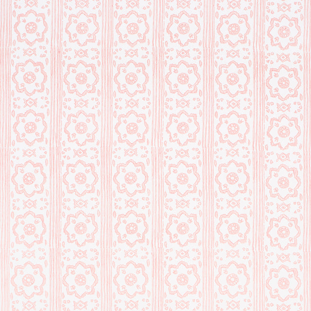 Sunda Hand Blocked Print wallpaper in blush by Schumacher, featuring a soft geometric pattern with stripes and medallions, handprinted for depth and dimension.