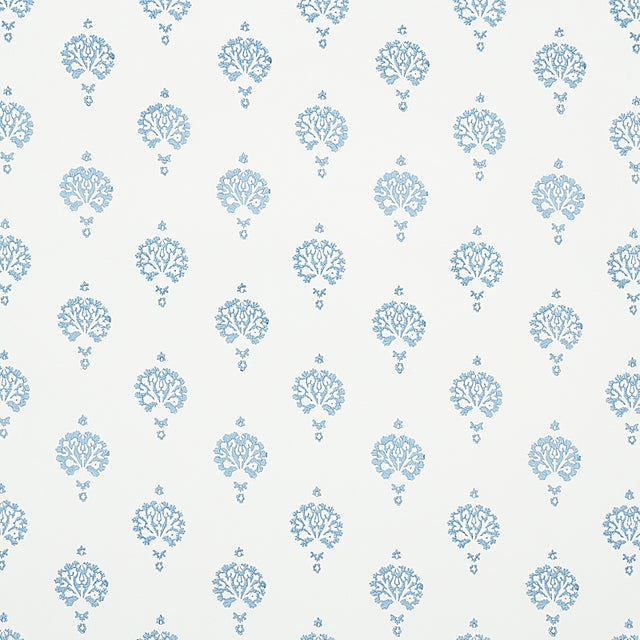 Dahlia Hand Blocked Print wallpaper in blue, featuring a simple floral motif hand printed with traditional block printing techniques.