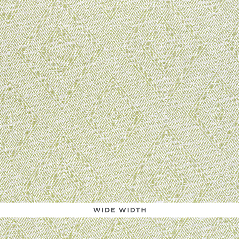 Tortola Paperweave green diamond geometric woven wallpaper by Schumacher, shown in close-up and installed in a bathroom.