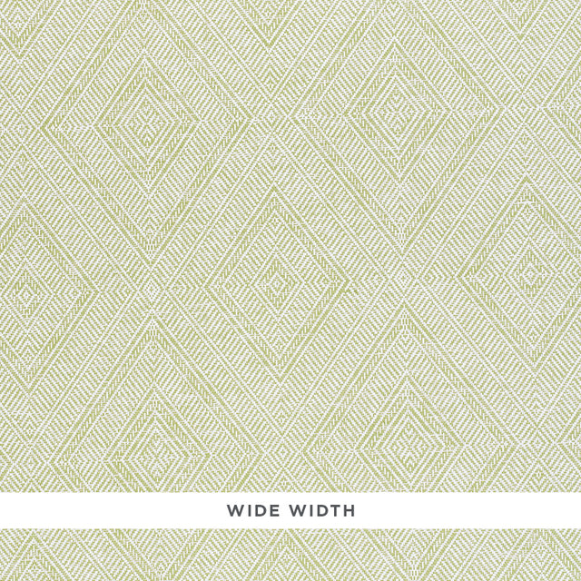 Tortola Paperweave green diamond geometric woven wallpaper by Schumacher, shown in close-up and installed in a bathroom.