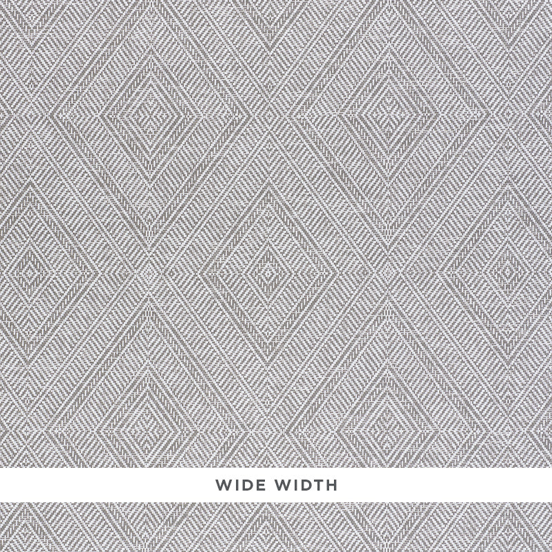 Tortola Paperweave wallpaper in grey with a diamond woven pattern, shown in detail and installed in a modern bedroom interior.