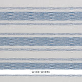 Oxnard Paperweave blue and white woven stripe wallpaper by Schumacher, shown in close-up and room setting