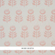 Rosenborg Pink stylized tulip hand block print wallpaper by Schumacher, shown in a modern nursery setting.