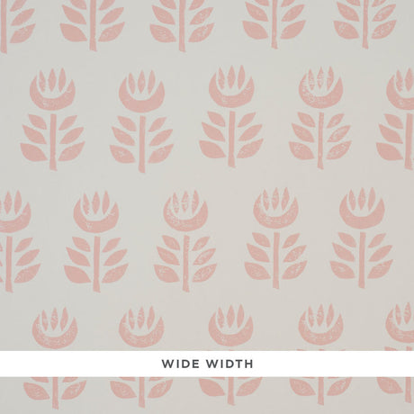 Rosenborg Pink stylized tulip hand block print wallpaper by Schumacher, shown in a modern nursery setting.