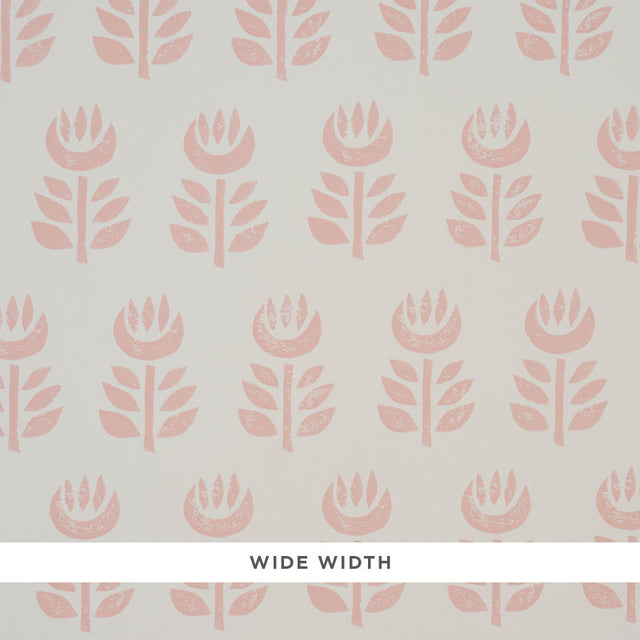 Rosenborg Pink stylized tulip hand block print wallpaper by Schumacher, shown in a modern nursery setting.