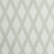 LES LOSANGES TOILE wallpaper in Stone by Schumacher, featuring a trellis and lozenge motif inspired by antique etchings, shown in a bathroom setting.