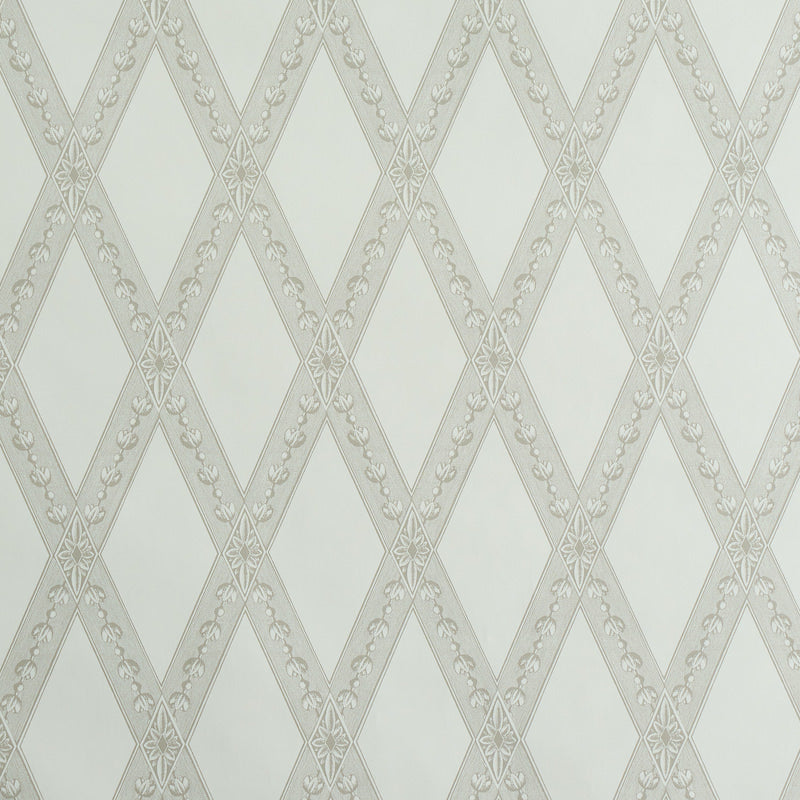 LES LOSANGES TOILE wallpaper in Stone by Schumacher, featuring a trellis and lozenge motif inspired by antique etchings, shown in a bathroom setting.
