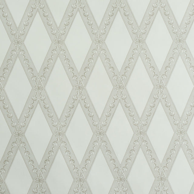 LES LOSANGES TOILE wallpaper in Stone by Schumacher, featuring a trellis and lozenge motif inspired by antique etchings, shown in a bathroom setting.