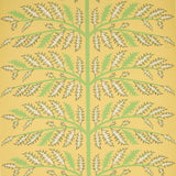 Thistle Mustard wallpaper by Neisha Crosland for Schumacher, featuring a stylized thistle motif in green and cream on a mustard yellow background.