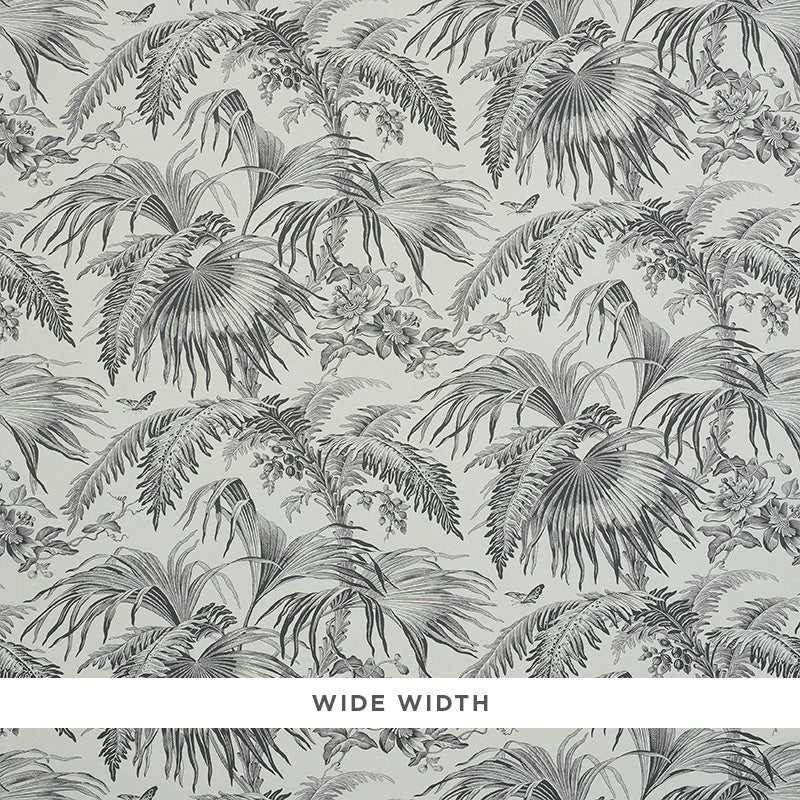 TOILE TROPIQUE wallpaper by Schumacher, featuring a black and white botanical tropical palm and floral design.