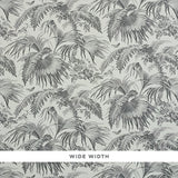 TOILE TROPIQUE wallpaper by Schumacher, featuring a black and white botanical tropical palm and floral design.