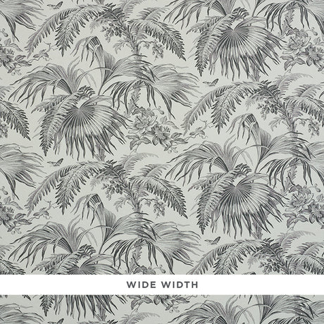 TOILE TROPIQUE wallpaper by Schumacher, featuring a black and white botanical tropical palm and floral design.