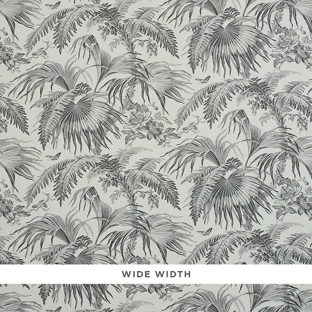 TOILE TROPIQUE wallpaper by Schumacher, featuring a black and white botanical tropical palm and floral design.