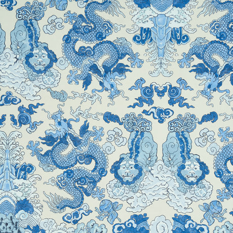 Blue and white wallpaper featuring dragons and foo dogs in a symmetrical, adventurous design. MAGIC MOUNTAIN DRAGON by Schumacher.