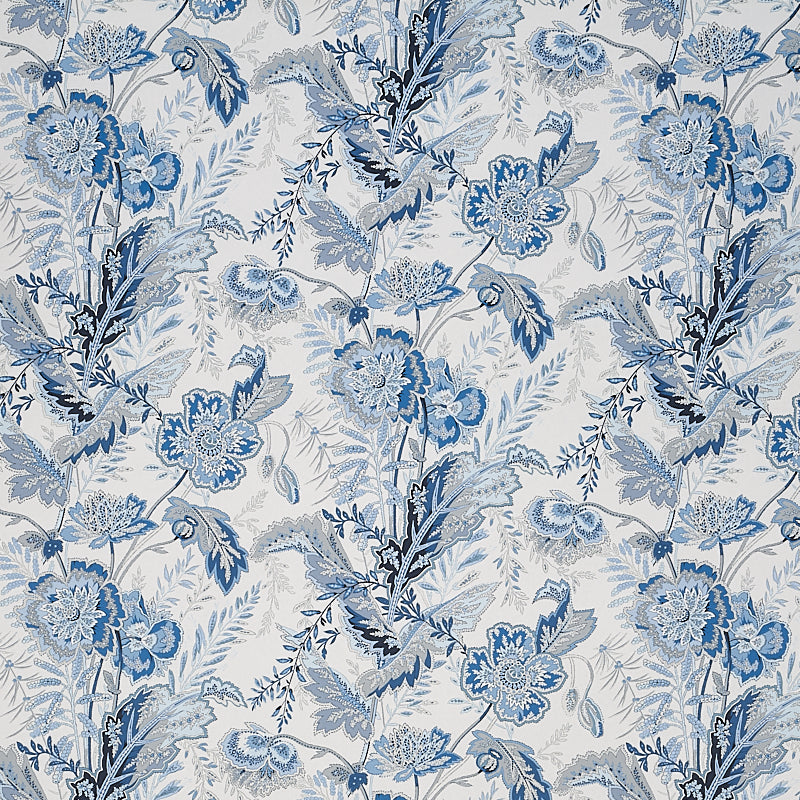 Sandoway Vine Delft blue floral wallpaper by Schumacher, inspired by 19th-century French Indienne prints, shown in a room setting and close-up details.