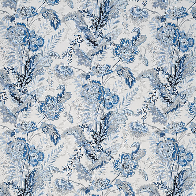 Sandoway Vine Delft blue floral wallpaper by Schumacher, inspired by 19th-century French Indienne prints, shown in a room setting and close-up details.