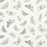Burnell Butterfly wallpaper in ivory by Schumacher features a whimsical butterfly stamp design with tonal variations in metallics.
