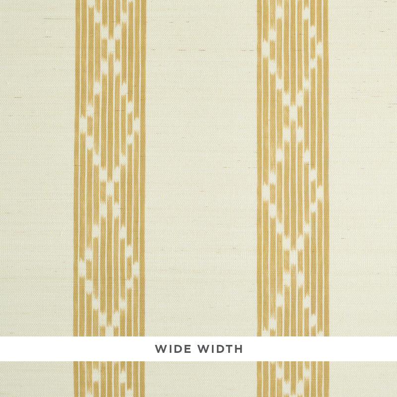 Sequoia Stripe Sisal wallpaper in ochre, featuring a wide-width abstract diamond trellis stripe pattern, styled in a bedroom setting.