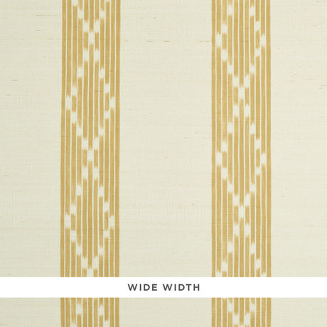 Sequoia Stripe Sisal wallpaper in ochre, featuring a wide-width abstract diamond trellis stripe pattern, styled in a bedroom setting.