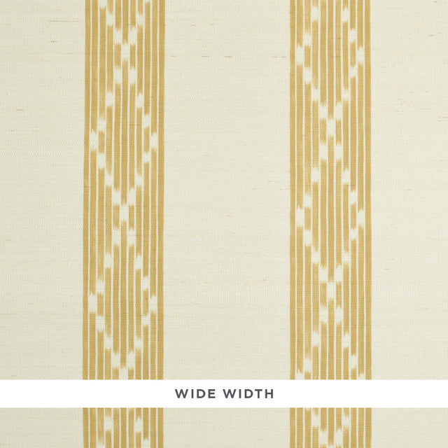 Sequoia Stripe Sisal wallpaper in ochre, featuring a wide-width abstract diamond trellis stripe pattern, styled in a bedroom setting.